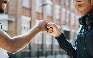 two people fistbumping